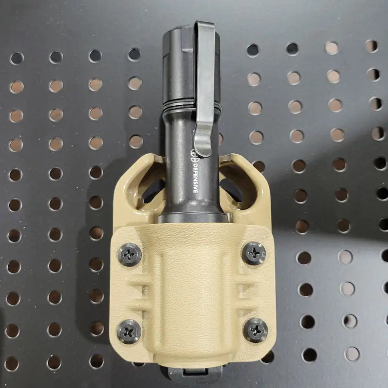 Black flashlight in tan holster for Cloud Defensive MCH Duty Flashlight Carrier