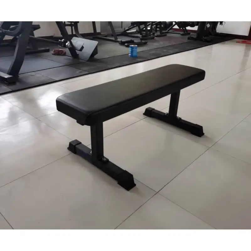 Black flat weight bench for fitness training, ideal for first responders, firefighters, police