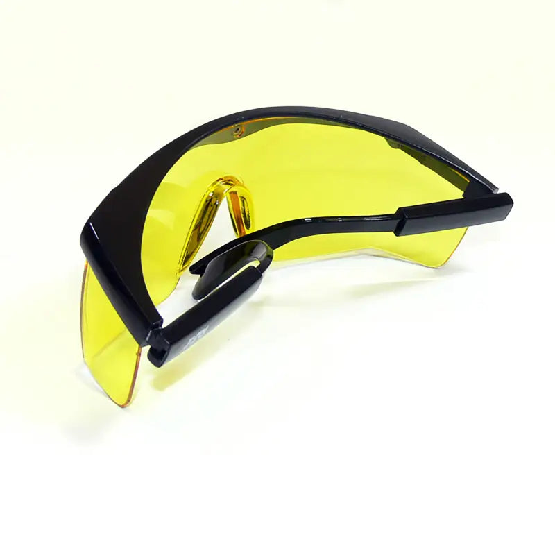 Black-framed yellow safety glasses with side shields for high impact protection ANSI Z87+