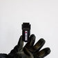 Black glove holding a dark USB flash drive from Handy Hook Firefighter Set