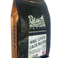 Black and gold pouch of One-Eyed Jack Blend naturally grown dark roast coffee beans with roast level and one pound weight