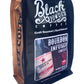 Black and gold pouch of Southern Star Bourbon Infused Coffee with bourbon bottle and beans