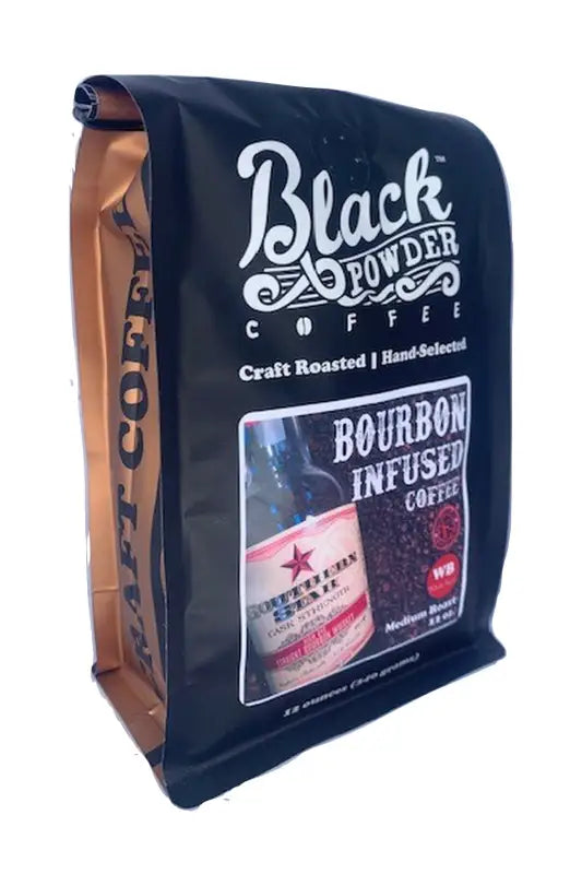 Black and gold pouch of Southern Star Bourbon Infused Coffee with bourbon bottle and beans