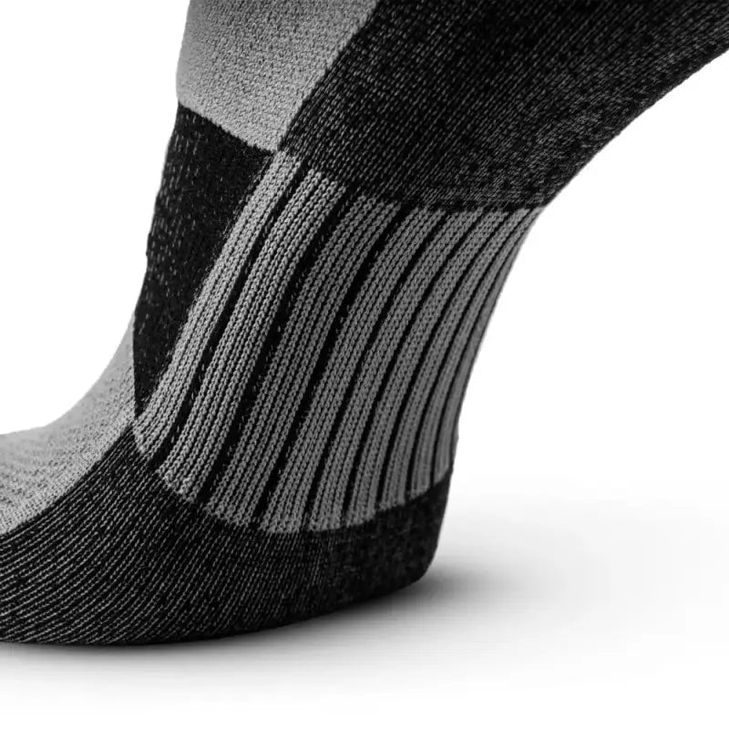 Black and gray no-show running socks with reinforced arch support to prevent hot spots