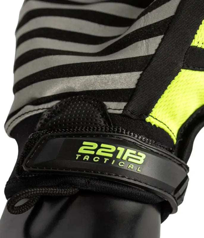 Black and gray striped Exxtremity Patrol Gloves 2.0 with hi-vis yellow accents