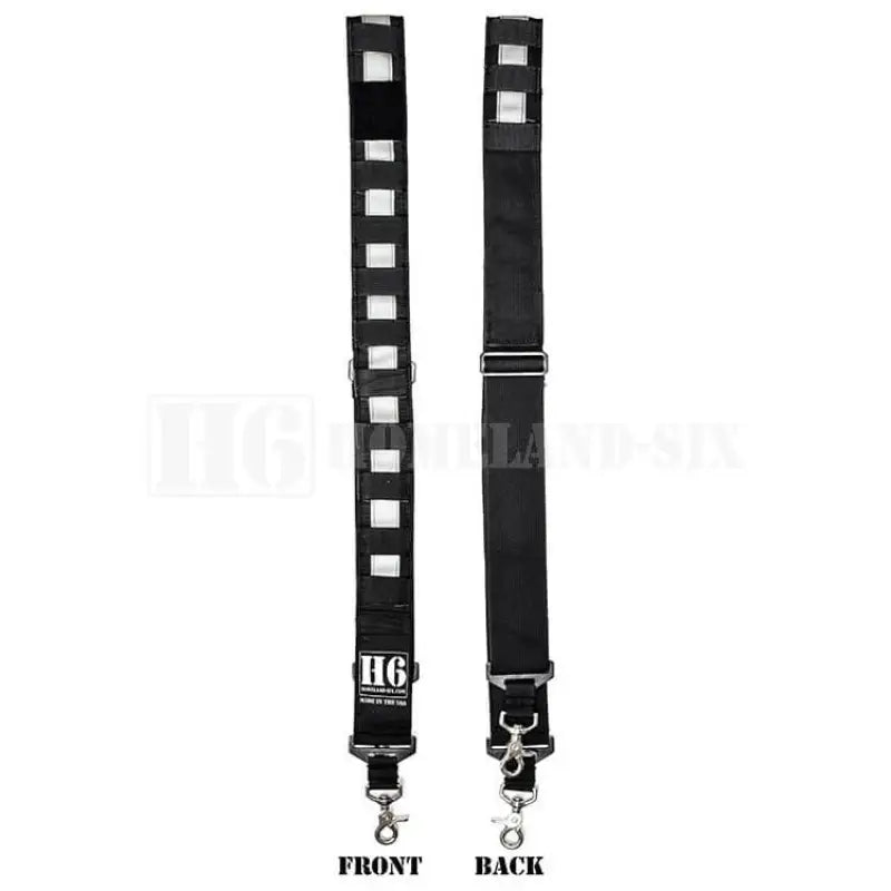 Black guitar strap with square cutouts and solid back for enhanced visibility in reduced visibility conditions