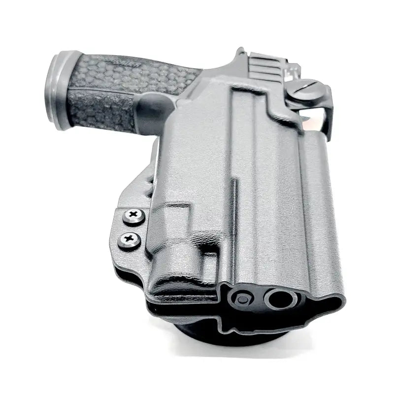 Black handgun in a holster compatible with Sig Sauer P365-FUSE and Streamlight TLR-7 by Four Brothers Holsters