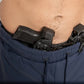 Black handgun in waistband of Navy Blue Carrier Shorts with patented carrier retention