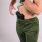 Black handgun tucked in waistband of Carrier Joggers Mk.II for concealed carry comfort