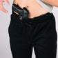 Black handgun in waistband of NEW Carrier Sweatpants Mk.II with patented carrier retention