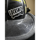 Black skateboarding helmet featuring a durable vinyl Locksmith helmet decal design