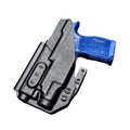 Black holster with blue handgun in Light Bearing IWB Holsters for secure carrying