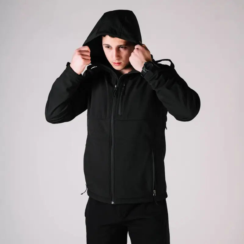 Black hooded tactical jacket Alpha with handy hand pocket for versatile outdoor wear