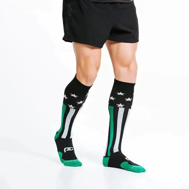 Black knee-high athletic socks with green and white stripes for First Responders