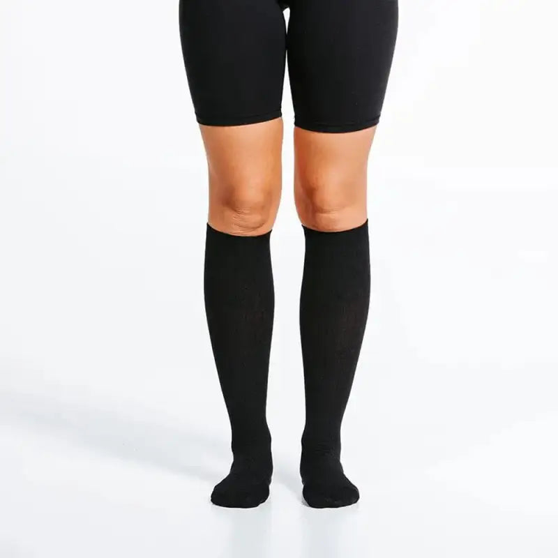 Black knee-high socks paired with cycling shorts from the Marathon collection