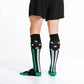 Black knee-high socks with white stripes and green accents for first responders