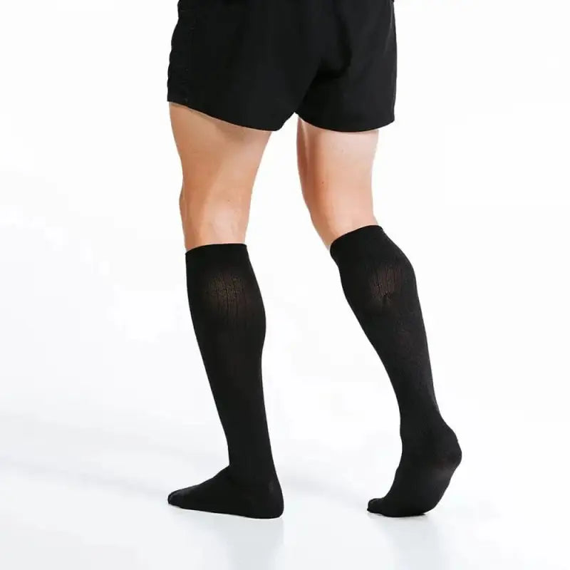 Black Marathon socks styled with black shorts for a sleek, sporty look