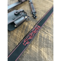 Black leather radio strap with red stitching and text embroidery for stylish support