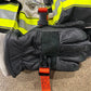 Black leather firefighter glove with orange safety strap attachment for first responders