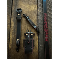 Black leather radio strap with red stitching and metal hardware for durability