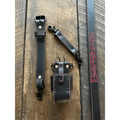 Black leather radio strap with red stitching and metal clips for secure storage