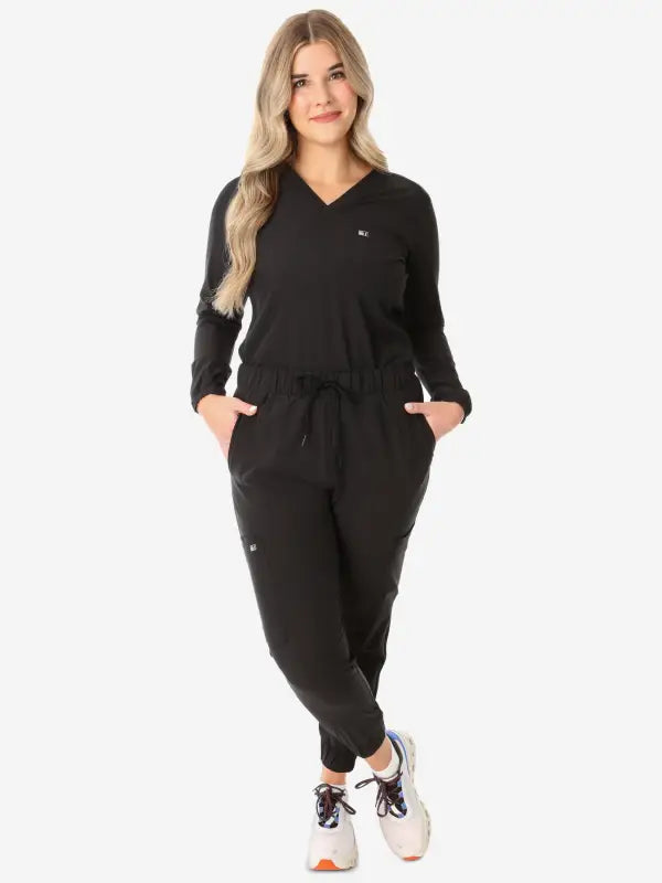 Black long-sleeve jumpsuit with drawstring waist, perfect for women’s long-sleeve scrub