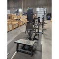 Black weightlifting machine on SFE Plate Loaded V-Squat Rack for strength training workouts