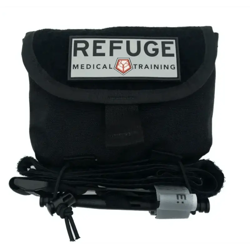 Black medical training pouch with REFUGE logo and tourniquet in Ranger Green style