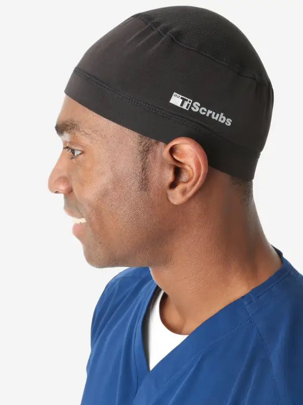 Black Men’s Scrub Cap with Scrubs branding worn on a head for medical professionals