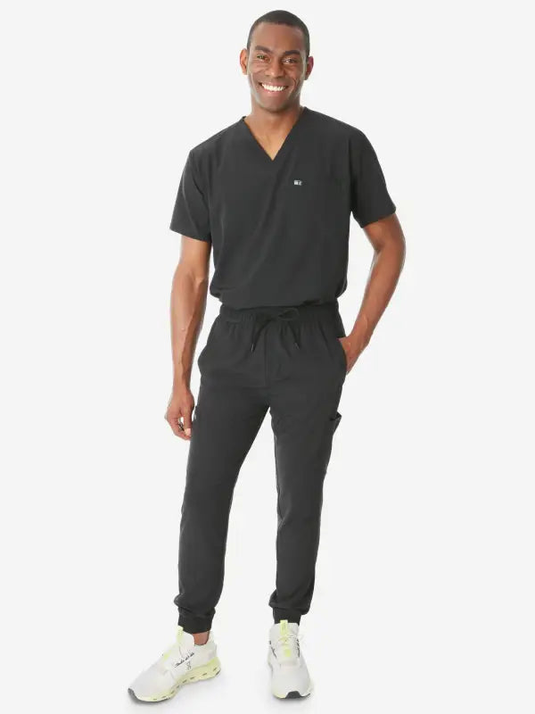 Black men’s double-pocket scrub uniform with jogger pants and v-neck top