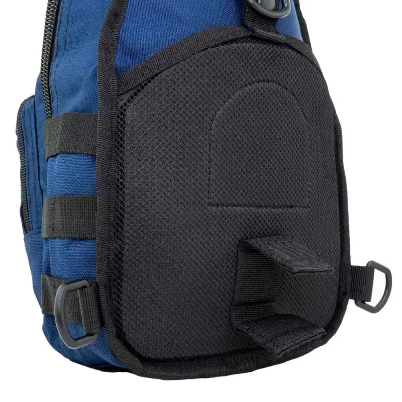 Black mesh accessory pocket on a blue Sling Backpack for bleeding control sling use