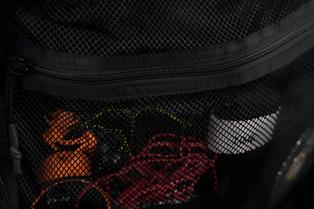 Black mesh backpack with removable magazine pouch in the SUMMIT discreet rifle backpack