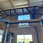 Black metal power rack for strength training and squat exercises at SFE Commercial Full Power Rack
