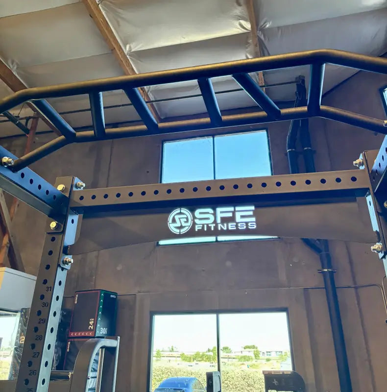 Black metal power rack for strength training and squat exercises at SFE Commercial Full Power Rack