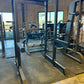 Black metal power rack for strength training and squat exercises in SFE Commercial series