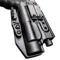 Black molded holster with retention features for Light Bearing IWB Holsters