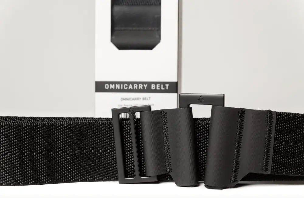 Black nylon OmniCarry Retention Belt with buckle for secure retention and carry