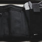 Black nylon fanny pack with gun holster, ideal accessory for first responders and police
