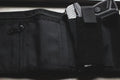 Black nylon fanny pack with gun holster, ideal accessory for first responders and police