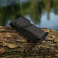 Black nylon pouch for M-Tac Multitool Type 5 resting on tree bark background