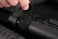 Black nylon strap adjusts on a rifle barrel for SUMMIT Discreet Rifle Backpack
