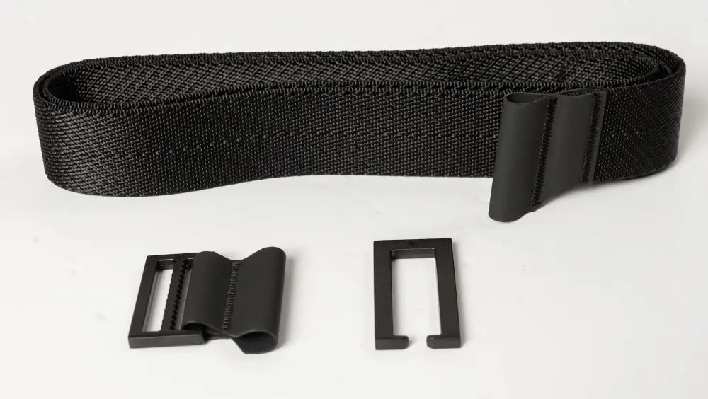 Black nylon strap with plastic buckles on OmniCarry Retention Belt for secure retention