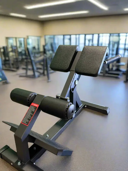 Black padded hyperextension bench on SFE Commercial Roman Chair for effective roman chair workouts