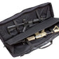 Black padded Assault Systems Double Agent rifle case holding two tactical rifles with scopes