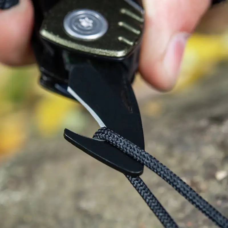 Black paracord cut with a folding knife using M-Tac Universal Tool Type 2 Green/Black