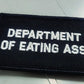 Black 2x3 patch with white embroidered text reading DEPARTMENT OF EATING ASS for socials