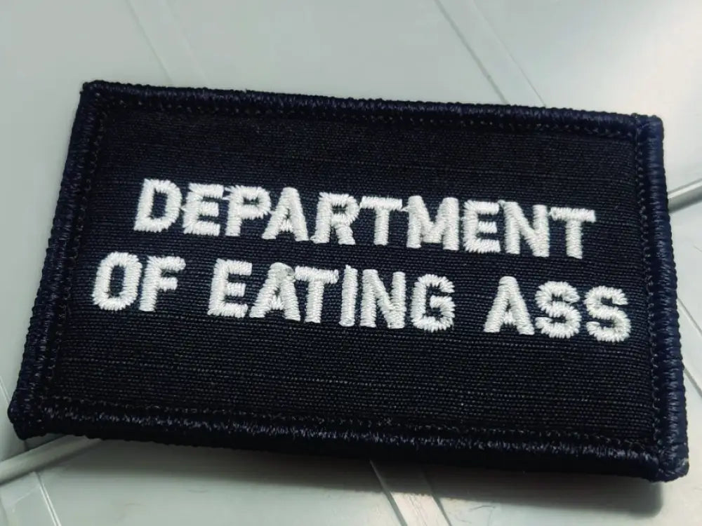 Black 2x3 patch with white embroidered text reading DEPARTMENT OF EATING ASS for socials