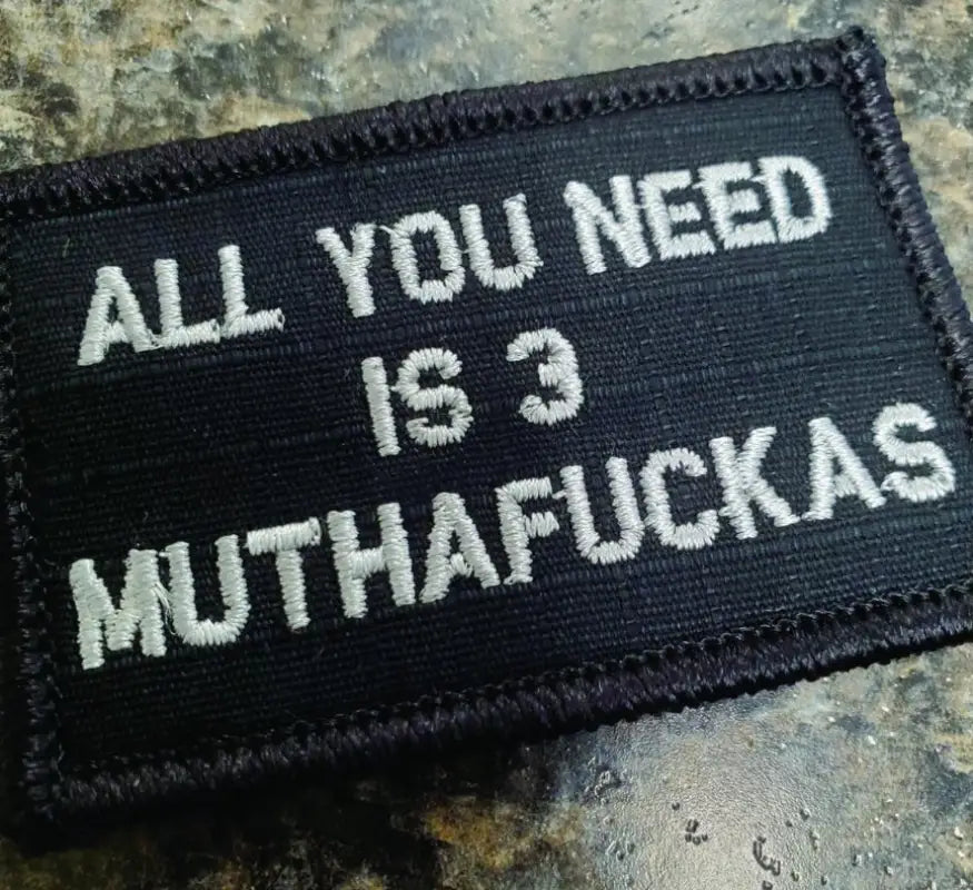 Black w silver 2x3 patch featuring text All You Need Is 3 Muthafuckas