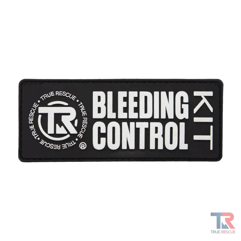 Black patch with white text BLEEDING CONTROL KIT and TR logo for True Rescue® Bleeding Control