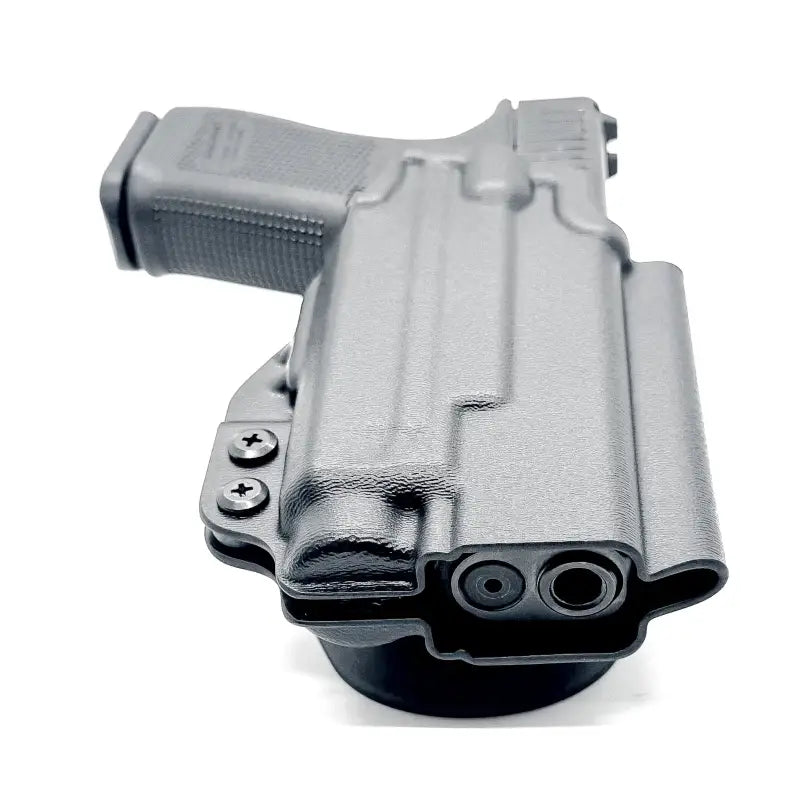 Black Glock 19 in a competition holster with Nightstick TCM-10 for weapon lights